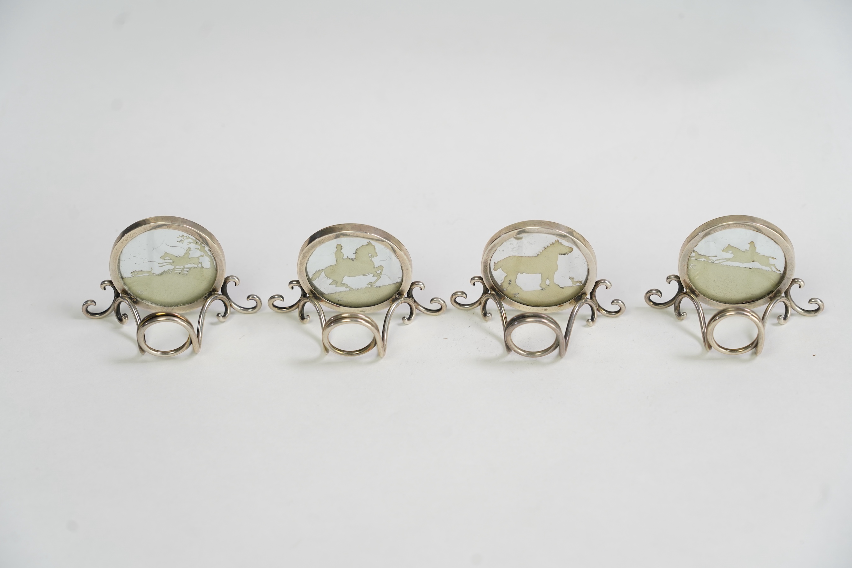 A set of four Edwardian silver menu holders, by Elkington & Co